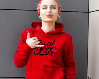 Young blonde woman wearing a red bandana and red hoodie that has Good Vibes Only printed on front.