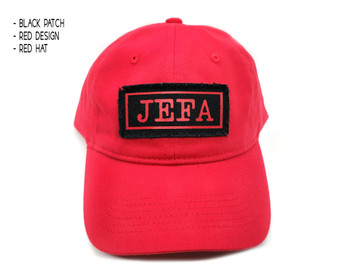 Front view of red dad hat with jefa patch.