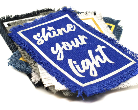 Shine Your Light iron on patch in a variety of customized colorways.