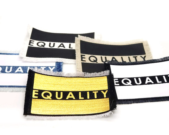 Five equality iron on patches in different color combinations.