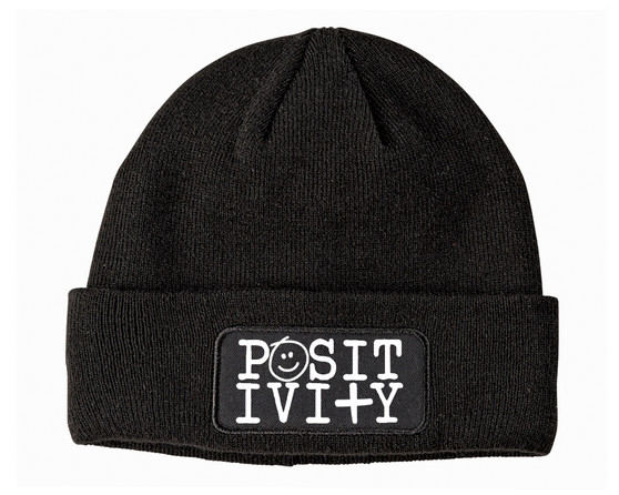 Black beanie with positivity printed on the patch.