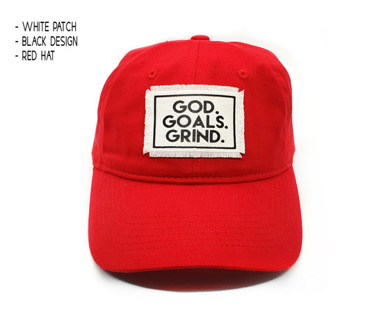 Front view of red date hat with white and black god goals grind patch.