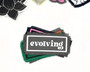 Iron on patches in different color combinations with the words evolving on it.