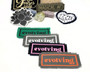 Iron on patches in different color combinations with the words evolving on it.