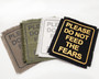 Iron on patch in a variety of colors with the words "Please Do Not Feed The Fears".