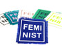 Feminist square iron on patches in various color combinations.