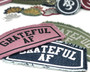Grateful AF iron on patches in a variety of colorways.