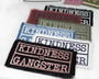 Kindness is gangster iron on patches in a variety of colors.
