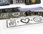 Symbols of peace love and happiness on various iron on patches.