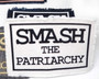 Smash the patriarchy feminist iron on patch in various colors.