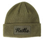 Olive green winter beanie with the word Hustle in black printed on a patch.