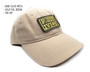 Side view of tan dad hat with positivity patch.