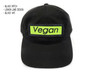 Front view of black dad hat with black and lemon lime vegan patch.