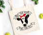 Natural canvas vegan tote bag with  a cow and the words not your mom not your milk design.