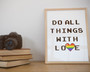 Do all things with love printed on a framed poster.