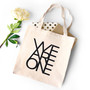 We are one printed on natural canvas tote bag.