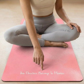 Woman seated on Rose Pink yoga mat in a calm home space, non-slip fitness mat for meditation and practice