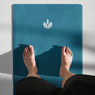Woman standing on Deep Teal  microfibre non slip yoga mat