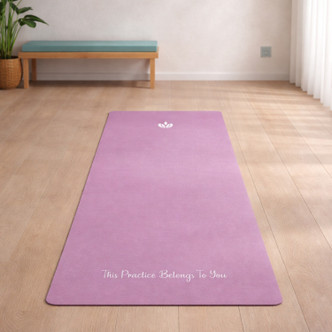 Personalised yoga mat in Orchard Pink with “This Practice Belongs To You” text in a minimalist home yoga space, non-slip fitness mat for meditation and daily practice