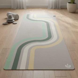 Neutral retro stripe yoga mat with green, cream and yellow curved design displayed on a light wooden floor