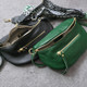 Black and green leather crossbody bags with woven bohemian shoulder straps