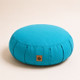 Blue Neuhaus Zen Comfort Zafu meditation cushion with organic cotton cover and buckwheat hull filling on a warm off-white studio background.