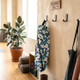 floral yoga mat bag hanging on wall in home studio