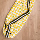 lemon print yoga mat bag laid flat on wooden floor