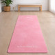 Rose Pink yoga mat laid flat in a bright room, non-slip fitness mat for home yoga and daily movement