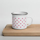 Minimalist white enamel travel mug with red Crowns pattern print design on a neutral background, ideal for a cosy tea or coffee break