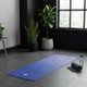 Blue Indigo mist gradient yoga mat, non-slip fitness mat in a bright modern room with plants and yoga props