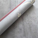 Rolled grey leaf TPE suede yoga mat showing botanical design, non-slip base and soft top layer