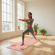 Compact pink suede TPE yoga mat with Love and Life design used for home yoga practice.