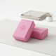 Pink EVA yoga blocks for balance, stretching and yoga support during home practice.