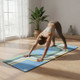 Person practising yoga on the Retro Pathway natural rubber yoga mat with a non-slip microfibre suede surface.