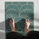 Top-down view of green Art Deco yoga mat showing gold geometric fan pattern
