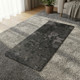 Geo Zen microfibre suede natural rubber yoga mat laid flat showing black geometric design