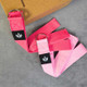 2pink yoga stretching straps set folded on floor