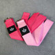 two pink yoga straps with metal D rings displayed NEUHAUS ZEN