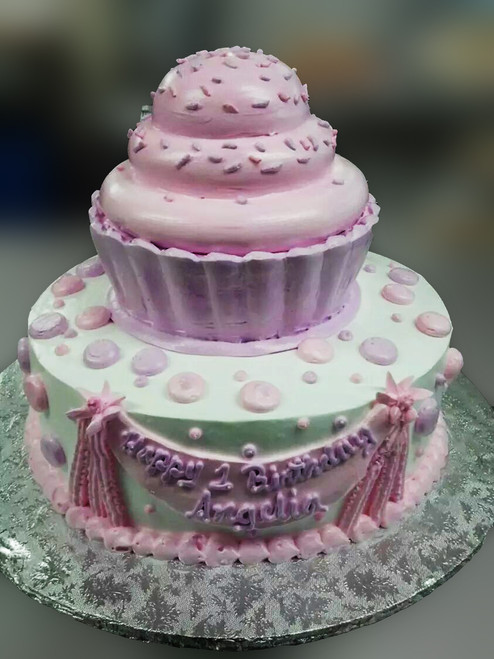 This a 7" tall cupcake on top of 12" cake.  The entire creation is sculpted only with cake and frosting.  Your banner will have any text you desire!