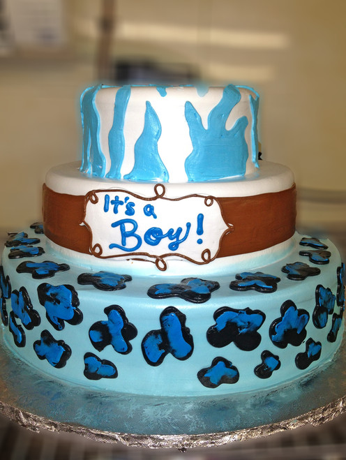 Approximate Servings 80. Sizes: 7", 10" & 14". Three tiered animal print baby shower themed cake.