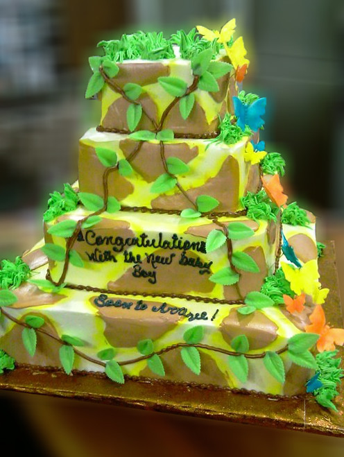 Approximate Servings 145. Sizes: 1/8 sheet sq, 1/4 sheet sq, 1/2 sheet sq & 3/4 sheet sq. This jungle themed baby shower cake has cascading sugar butterflies to lighten it up a bit with some color and detail.