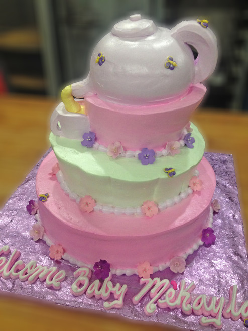 Approximate Servings 80. Sizes: 7", 10" & 14". Tea party topsy turvy cake with tea pot and all. Sugar flower and butterfly accents just as an added bonus.