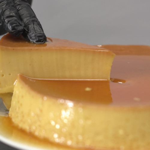Whole flan, the first slice lifted out
