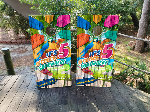 Tropical beach cornhole boards with colorful parrot, “It’s 5 O’Clock Somewhere” text, palm trees, and ocean scenery, built to professional regulation standards.