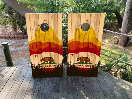 "California Flag Cornhole Boards featuring California Republic bear flag design with rustic wood background and vintage style"