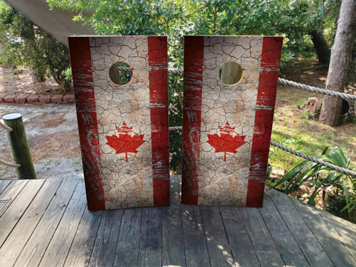 cornhole boards featuring a distressed Canadian flag