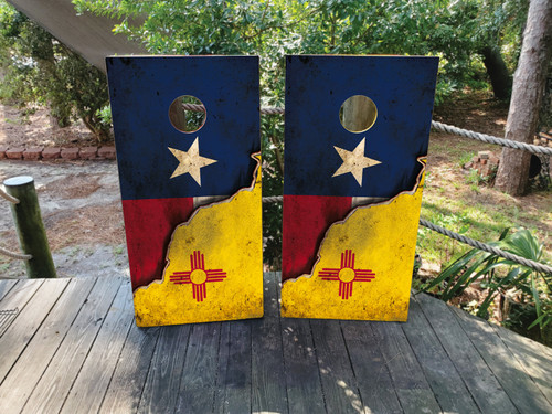 Cornhole boards featuring a distressed texas flag on top and a new mexico flag on the bottom