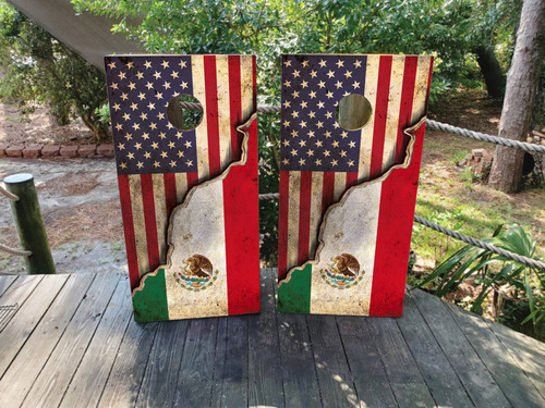 Cornhole boards featuring a distressed USA Flag on top and a Mexican Flag on the bottom