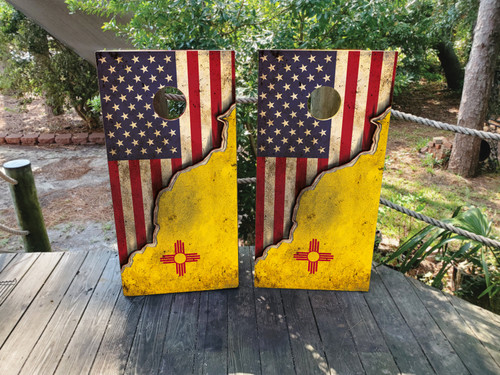 Cornhole boards featuring a distressed USA Flag on top and a New Mexico Flag on the bottom